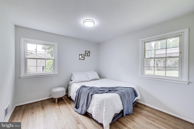 11408 Woodson Ave, Kensington, MD 20895 - bedroom with light wood finished floors and baseboards
