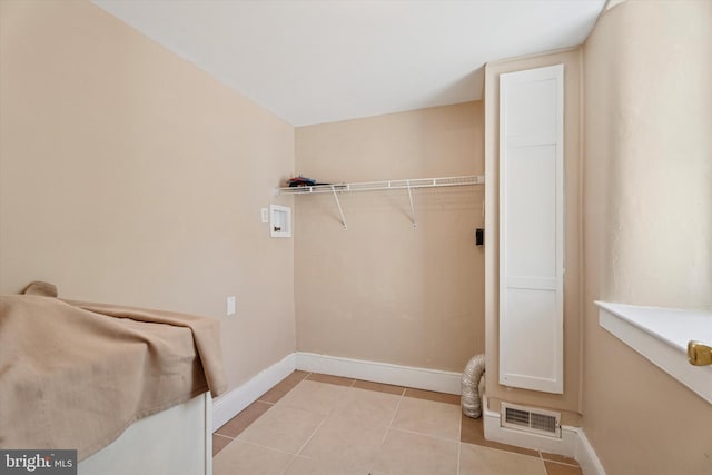 1127 Pawlings Rd, Norristown, PA 19403 - laundry area featuring washer hookup, baseboards, and light tile patterned flooring