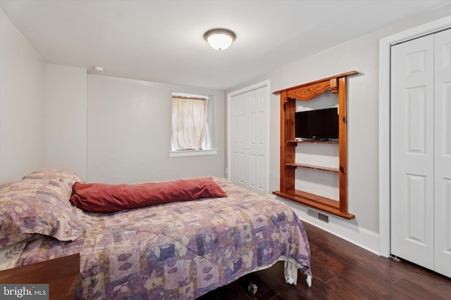 1127 Pawlings Rd, Norristown, PA 19403 - bedroom featuring dark wood-type flooring, two closets, and baseboards