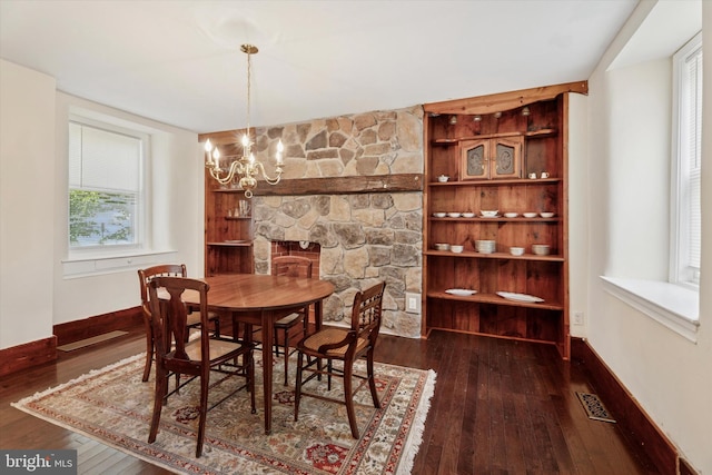 1127 Pawlings Rd, Norristown, PA 19403 - dining space featuring dark wood-style flooring, a chandelier, and baseboards