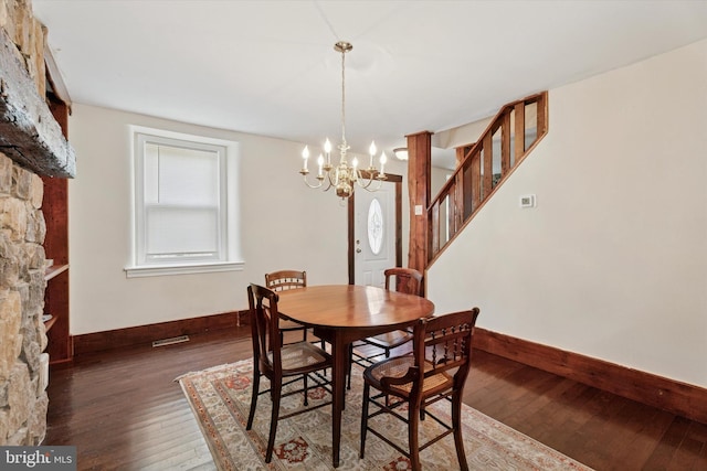 1127 Pawlings Rd, Norristown, PA 19403 - dining room with baseboards, hardwood / wood-style flooring, a chandelier, and stairway