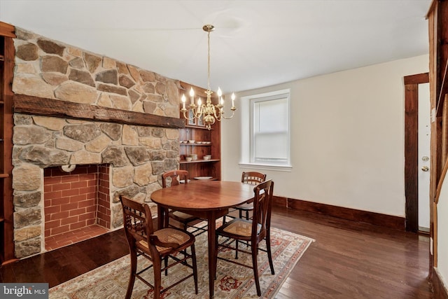 1127 Pawlings Rd, Norristown, PA 19403 - dining space featuring wood finished floors, baseboards, a chandelier, and a fireplace