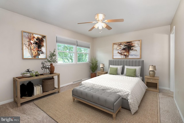 carpeted bedroom featuring baseboards and a ceiling fan