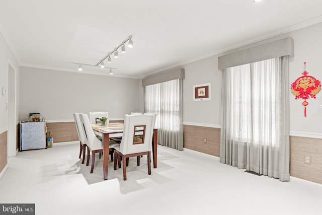 72 Leearden Rd, Hershey, PA 17033 - carpeted dining area with crown molding, rail lighting, and baseboards