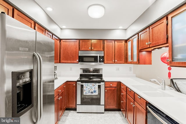 72 Leearden Rd, Hershey, PA 17033 - kitchen featuring stainless steel appliances, a sink, light countertops, recessed lighting, and brown cabinets