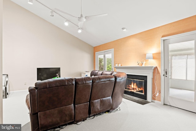 72 Leearden Rd, Hershey, PA 17033 - carpeted living room featuring a fireplace with flush hearth, vaulted ceiling, baseboards, and ceiling fan