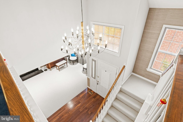 72 Leearden Rd, Hershey, PA 17033 - stairway featuring a chandelier, wood finished floors, and wallpapered walls