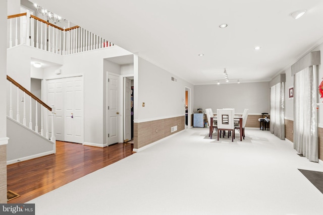 72 Leearden Rd, Hershey, PA 17033 - dining space with stairway, wainscoting, wood finished floors, track lighting, and crown molding