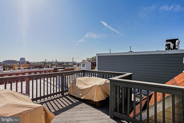 deck featuring a grill