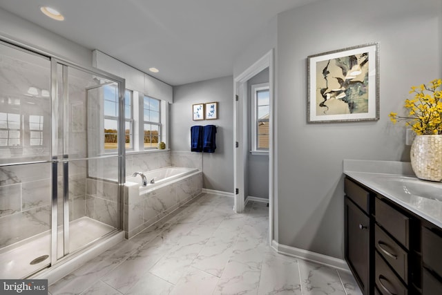 full bath with marble finish floors, a shower stall, a garden tub, and recessed lighting