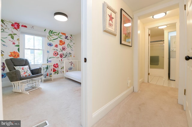 corridor with carpet and baseboards