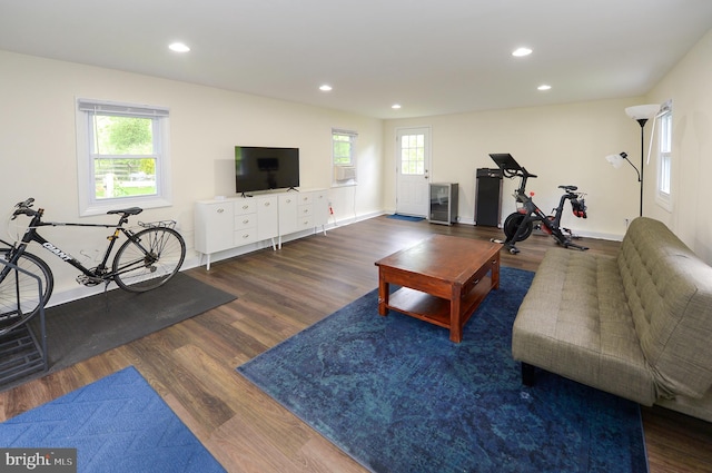living room with wood finished floors, recessed lighting, cooling unit, wine cooler, and baseboards