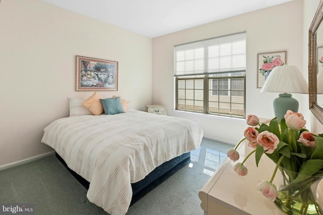 bedroom with carpet and baseboards