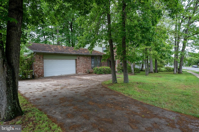 402 Old Courthouse Rd NE, Vienna, VA 22180 - view of front facade featuring brick siding, an attached garage, driveway, and a front lawn