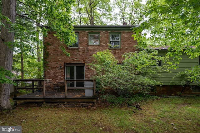 402 Old Courthouse Rd NE, Vienna, VA 22180 - rear view of property featuring a wooden deck and brick siding