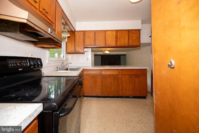 402 Old Courthouse Rd NE, Vienna, VA 22180 - kitchen featuring black range with electric cooktop, a sink, under cabinet range hood, brown cabinetry, and light countertops