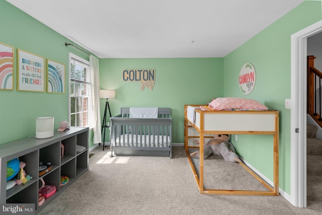 1338 Lowman St, Baltimore, MD 21230 - bedroom featuring carpet, baseboards, and a nursery area