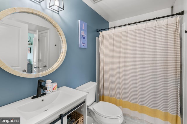 1338 Lowman St, Baltimore, MD 21230 - bathroom featuring toilet, vanity, and a shower with shower curtain