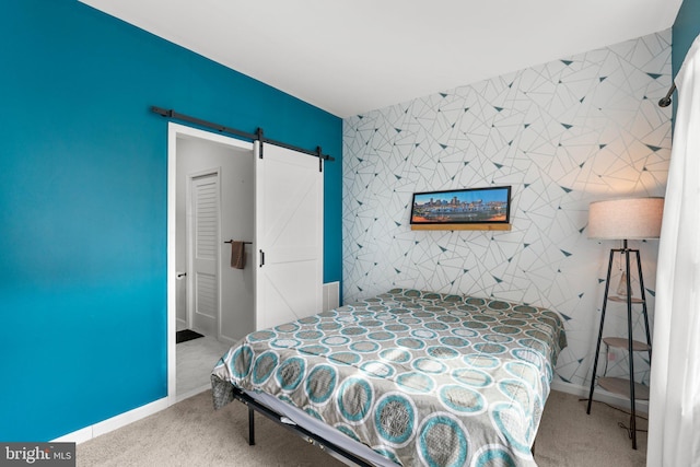 1338 Lowman St, Baltimore, MD 21230 - carpeted bedroom featuring a barn door and baseboards