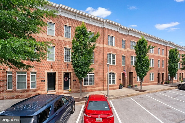 1338 Lowman St, Baltimore, MD 21230 - view of building exterior with uncovered parking