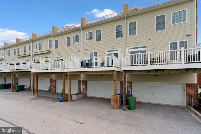 1338 Lowman St, Baltimore, MD 21230 - back of property with a garage and brick siding