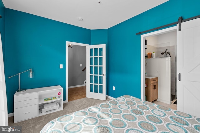 1338 Lowman St, Baltimore, MD 21230 - carpeted bedroom with a barn door and baseboards