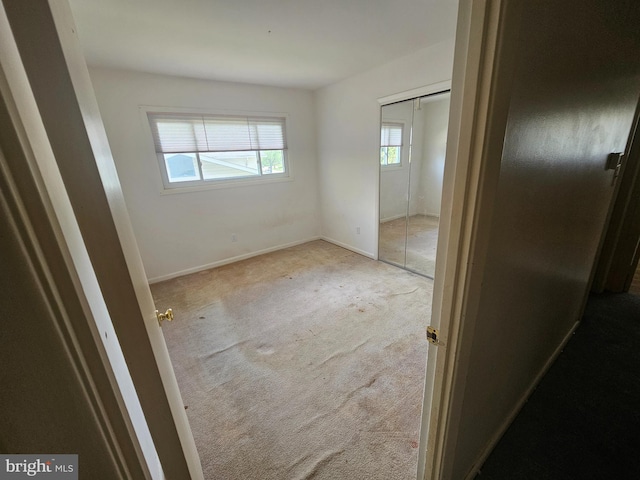 7023 Dolphin Rd, Lanham, MD 20706 - unfurnished bedroom with carpet, a closet, and baseboards