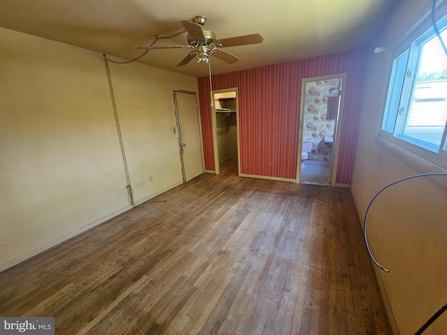 7023 Dolphin Rd, Lanham, MD 20706 - unfurnished bedroom with wood finished floors, baseboards, and a ceiling fan