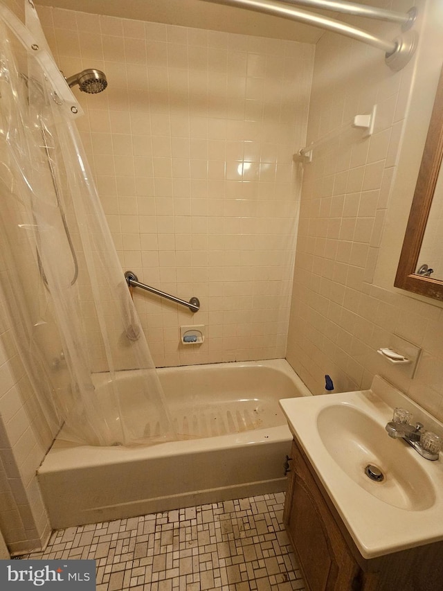 7023 Dolphin Rd, Lanham, MD 20706 - bathroom featuring shower / bath combination with curtain, vanity, tile walls, and tile patterned floors