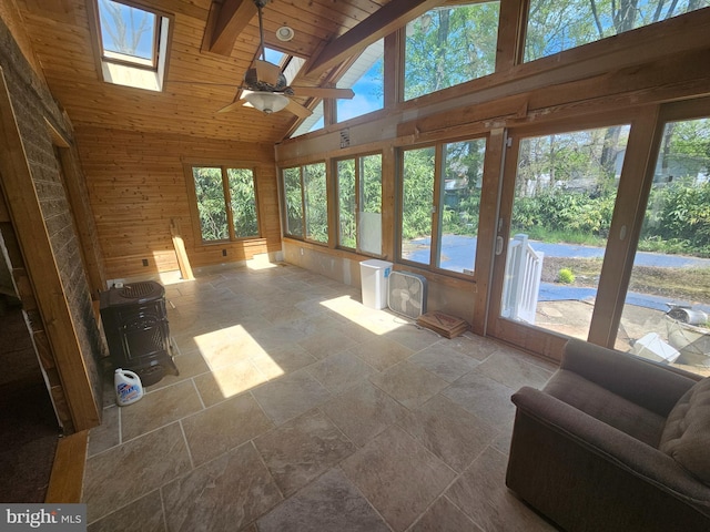 7023 Dolphin Rd, Lanham, MD 20706 - sunroom featuring stone tile floors, a skylight, high vaulted ceiling, wood walls, and wood ceiling
