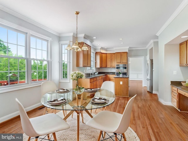 16028 Kings Mountain Rd, Woodbridge, VA 22191 - dining space featuring baseboards, light wood-type flooring, ornamental molding, and recessed lighting