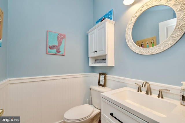 8931 Kiger St, Lorton, VA 22079 - half bath with wainscoting, toilet, and vanity