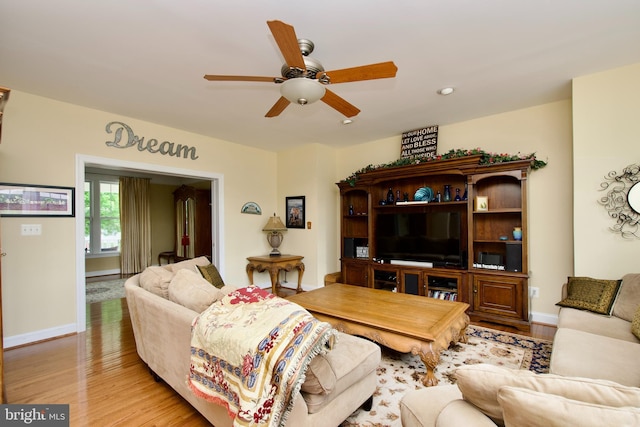 8931 Kiger St, Lorton, VA 22079 - living room featuring a ceiling fan, wood finished floors, and baseboards