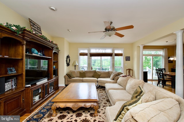 8931 Kiger St, Lorton, VA 22079 - living room featuring decorative columns, ceiling fan, plenty of natural light, and wood finished floors