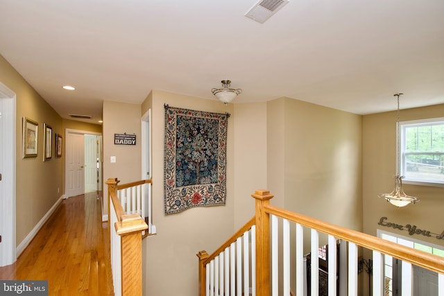 8931 Kiger St, Lorton, VA 22079 - hallway featuring an upstairs landing, light wood-style floors, recessed lighting, and baseboards