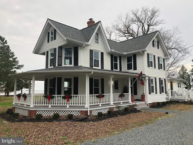 20456 Quarter Landing Ln, Nanticoke, MD 21840 - farmhouse inspired home with a porch, a chimney, and a shingled roof