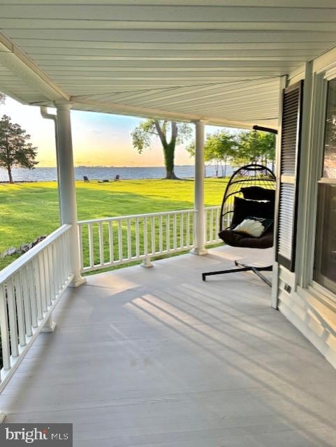20456 Quarter Landing Ln, Nanticoke, MD 21840 - patio terrace at dusk with a water view, a porch, and a yard