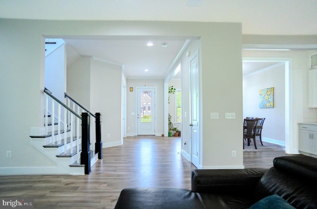 23883 Ebony Eyes Ct, Aldie, VA 20105 - entryway with wood finished floors, crown molding, baseboards, stairway, and recessed lighting