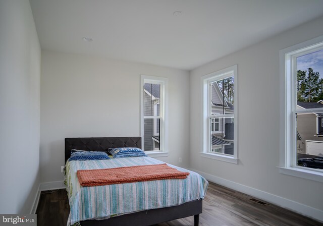 23883 Ebony Eyes Ct, Aldie, VA 20105 - bedroom with baseboards and wood finished floors