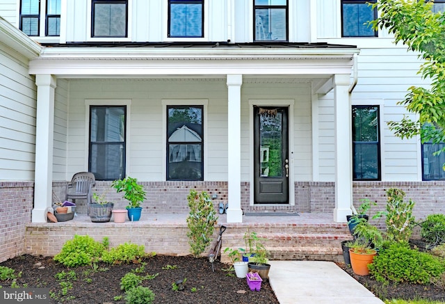 23883 Ebony Eyes Ct, Aldie, VA 20105 - entrance to property with covered porch and brick siding