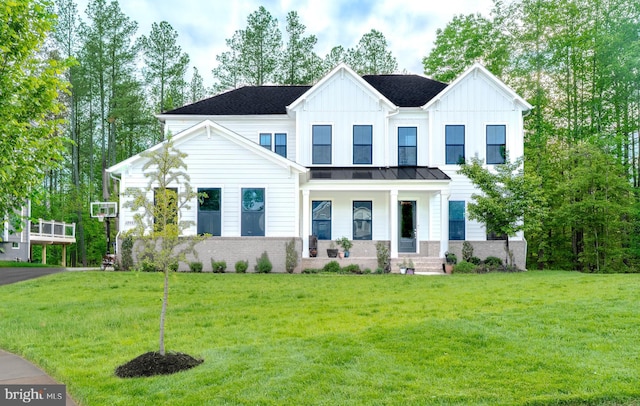 23883 Ebony Eyes Ct, Aldie, VA 20105 - view of front of property with a porch, a front yard, board and batten siding, a standing seam roof, and metal roof