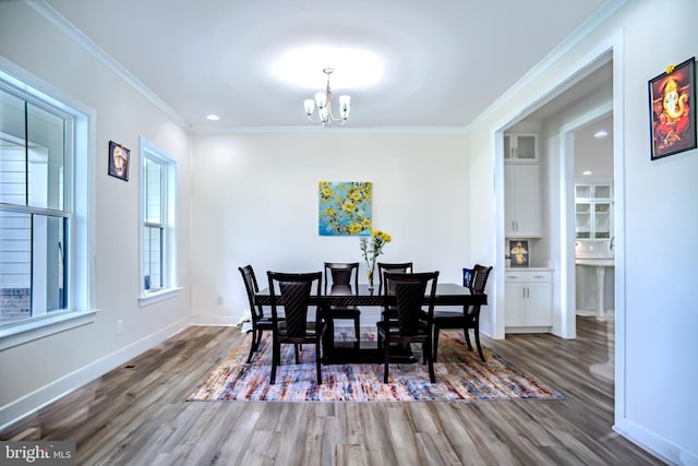 23883 Ebony Eyes Ct, Aldie, VA 20105 - dining space with a chandelier, wood finished floors, ornamental molding, baseboards, and recessed lighting