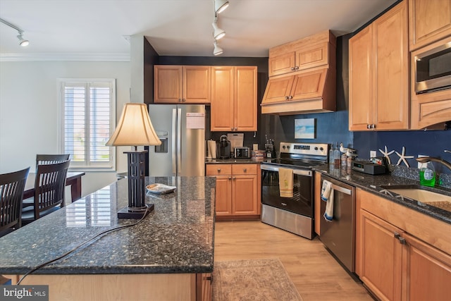 105 56th Unit 210P1, Ocean City, MD 21842 - kitchen with track lighting, appliances with stainless steel finishes, a sink, crown molding, and light wood finished floors