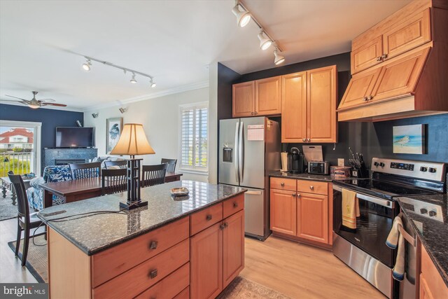 105 56th Unit 210P1, Ocean City, MD 21842 - kitchen featuring appliances with stainless steel finishes, rail lighting, light wood-type flooring, ornamental molding, and a ceiling fan