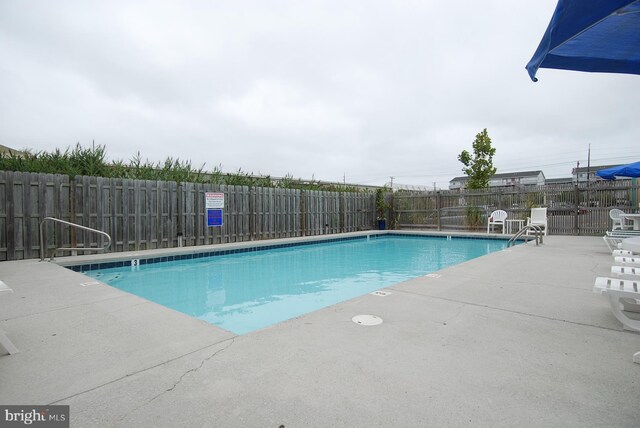 105 56th Unit 210P1, Ocean City, MD 21842 - community pool with a fenced backyard and a patio area