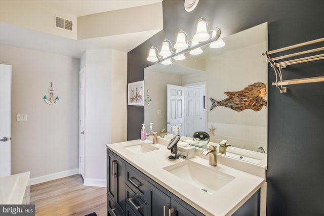 105 56th Unit 210P1, Ocean City, MD 21842 - full bathroom with wood finished floors, a bath, double vanity, and baseboards