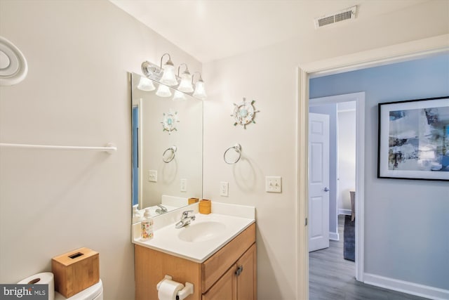 105 56th Unit 210P1, Ocean City, MD 21842 - bathroom featuring vanity, wood finished floors, baseboards, and toilet