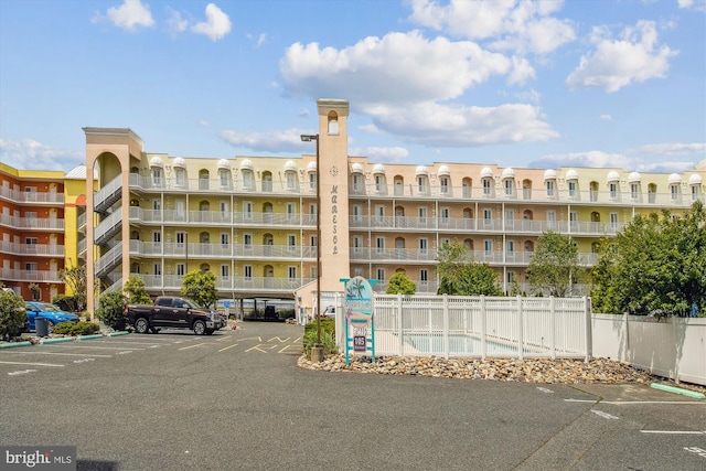 105 56th Unit 210P1, Ocean City, MD 21842 - view of apartment building / complex with uncovered parking and fence