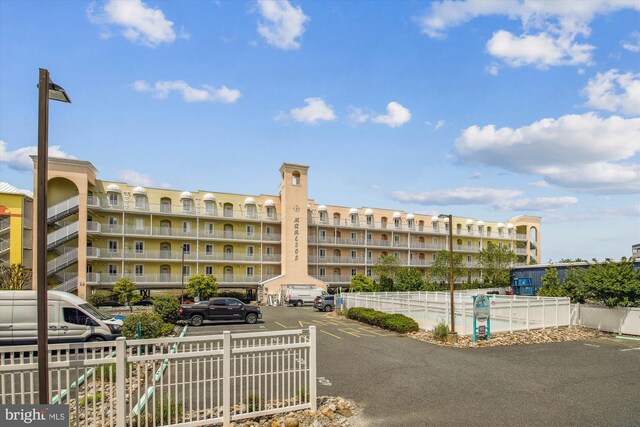 105 56th Unit 210P1, Ocean City, MD 21842 - view of apartment building / complex with uncovered parking and fence