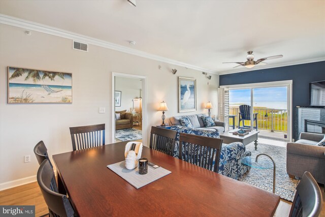 105 56th Unit 210P1, Ocean City, MD 21842 - dining area featuring a ceiling fan, ornamental molding, wood finished floors, and baseboards